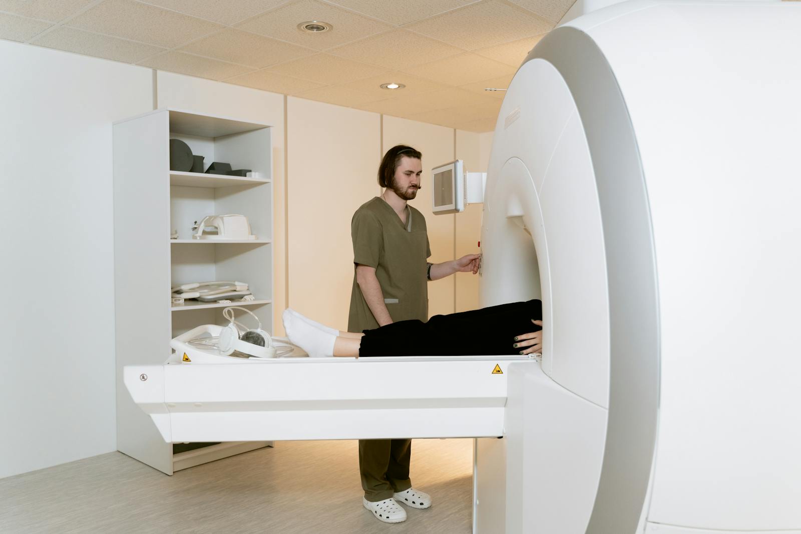 Radiology technologist operating imaging equipment